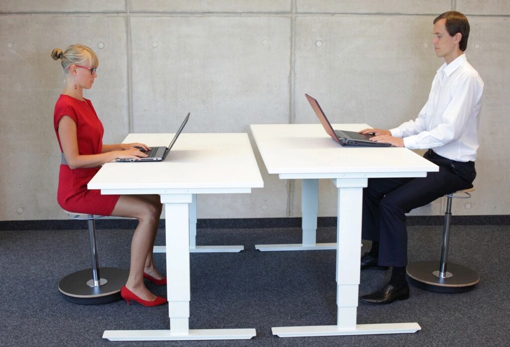 Two Business Workers Sitting in Proper Posture